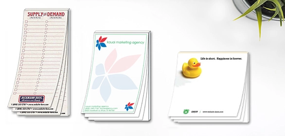 Three magnetic notepads including a checklist, marketing agency pad and a yellow rubber duck design.