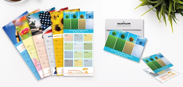 Fanned wall calendars with floral, flag, and landscape photos alongside a magnetic calendar and small calendar card.