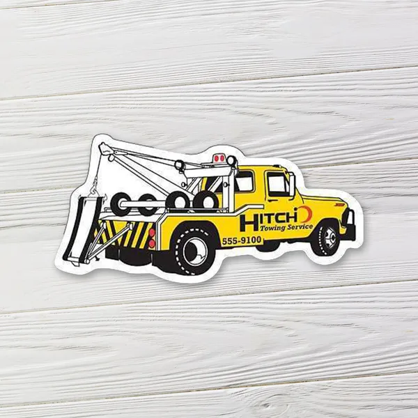 Yellow tow truck shaped magnet, 4.75"x2.25", promotional product with black and white details