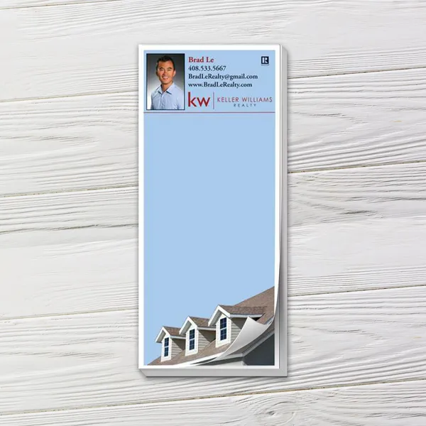 Custom notepad with blue background, house rooftop design, and professional contact section.