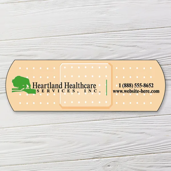Tan adhesive bandage-shaped custom magnet, 3.5"x1.125" with white polka dot design and green accent stripe.