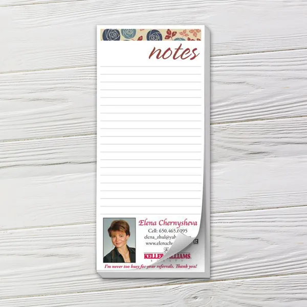 Custom notepad with floral header, lined pages, and business card section in cream, navy, and rose tones