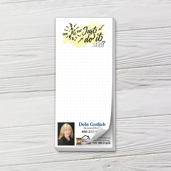 Custom notepad with yellow and black "Just Do It Later" design on white dotted grid paper