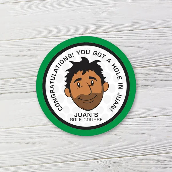 Green circle 2 inch promotional magnet with cartoon character design on white wooden surface