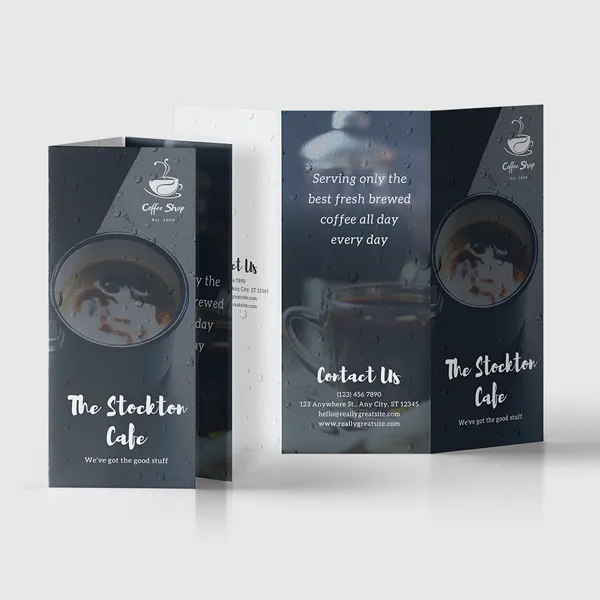 Tri-fold brochure mockup featuring dark navy and white color scheme with coffee cup imagery, custom promotional product de...