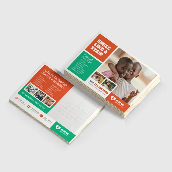 Natural Postcards Custom postcards with red and green color scheme, stack of promotional notecards displayed.