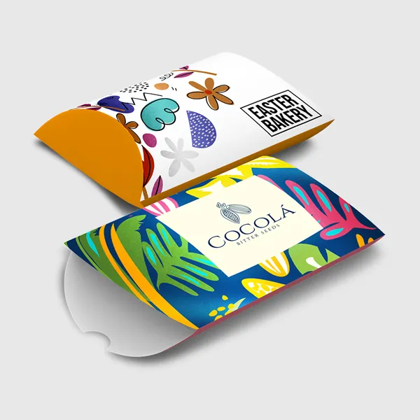 Akuafoil Pillow Boxes Colorful pillow boxes with vibrant tropical patterns and orange accents, custom promotional packaging