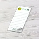 Custom 2 x 4 inch lined mini notepad with a pear logo for a computer repair shop, top sheet curling, on white wood