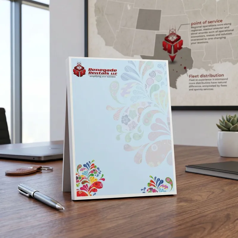 Custom 4.125 x 5.5 inch equipment rental notepad standing on a desk in front of a service area map