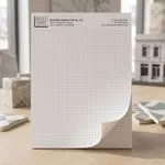 Custom 8.5 x 11 inch dot grid notepad standing upright, printed with an evenly spaced dot grid on a top-glued pad.