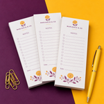 Custom 2 x 4 inch Marigold & Co mini notepads, three checkbox pads with floral borders, a yellow pen and paper clips