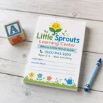 Custom 3 x 4 inch preschool memo pad with child's name and notes for parents lines, beside an ABC block and crayon